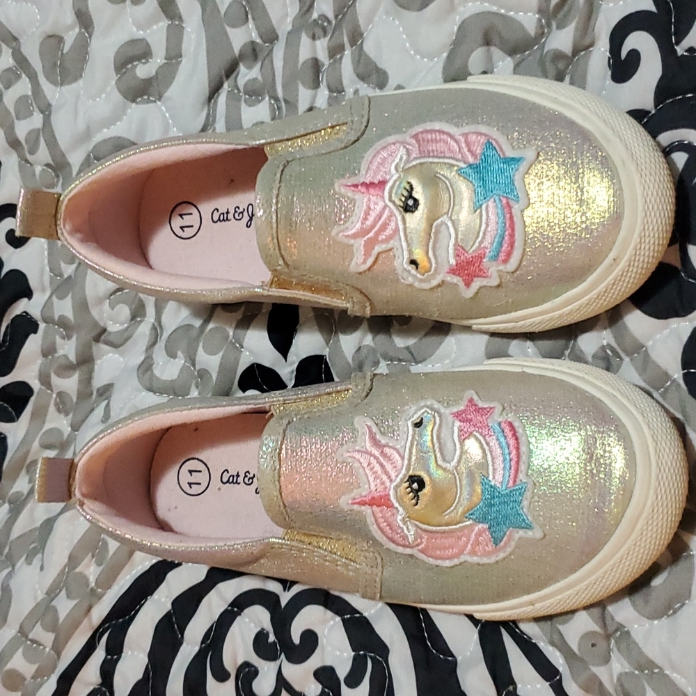 Toddler girls slip on shoes.